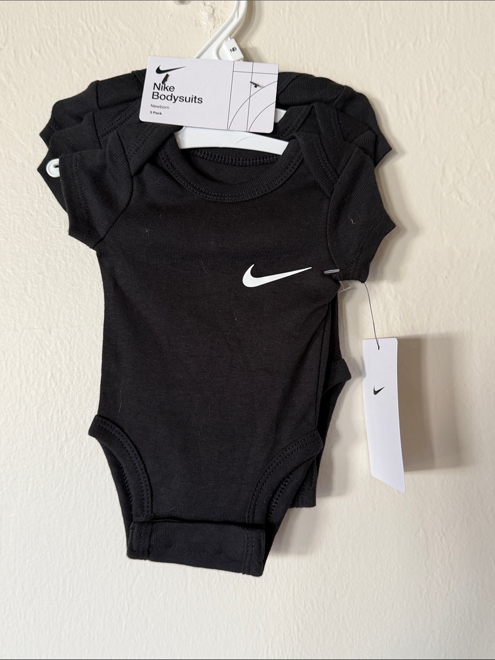 Nike Black newborn Bodysuit with White Swoosh - 3 Pack